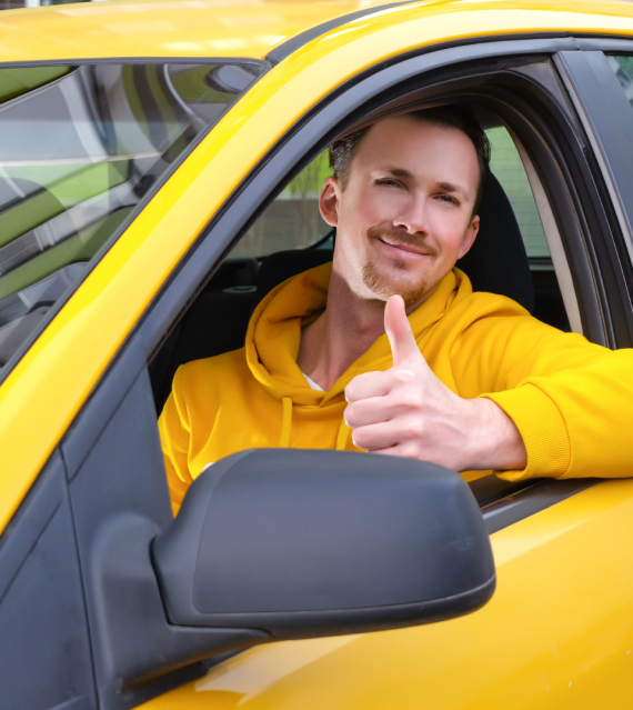 Driver in yellow taxi